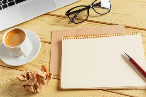 Office table background with coffee cup, pencils and computer keyboard. Business Stock Photos
