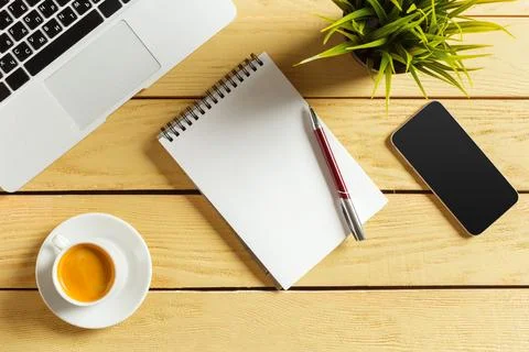Office table background with coffee cup, pencils and computer keyboard. Business Stock Photos