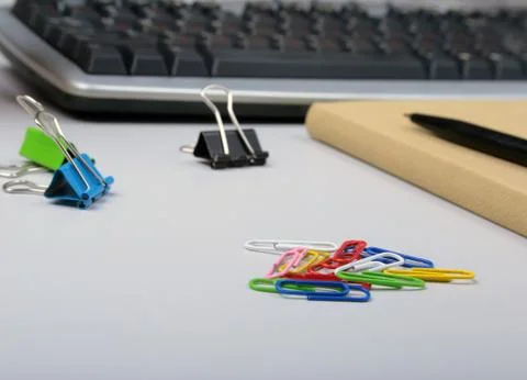 Office table with blank notepad and laptop, supplies and gadgets on desk. Top Stock Photos