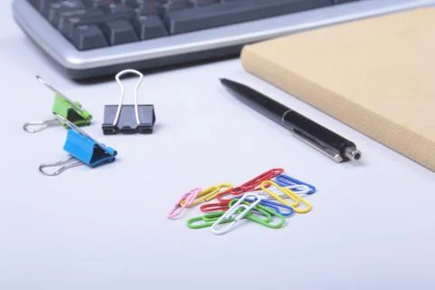Office table with blank notepad and laptop, supplies and gadgets on desk. Top Stock Photos