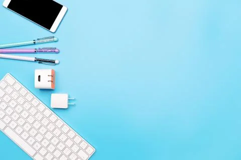 Office table with computer keyboard, smartphone and pen. topview, copy space Stock Photos