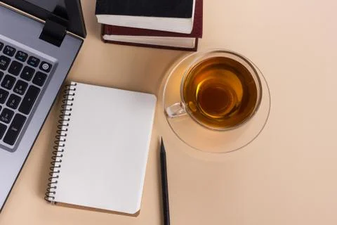 Office table desk with supplies, white blank note pad, cup, pen, pc, crumpled Stock Photos