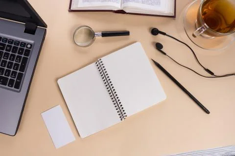 Office table desk with supplies, white blank note pad, cup, pen, pc, crumpled Stock-Fotos