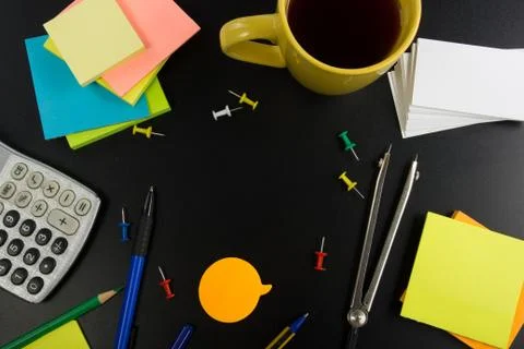 Office table desk top view with set of colorful supplies, white blank note pad Stock-Fotos