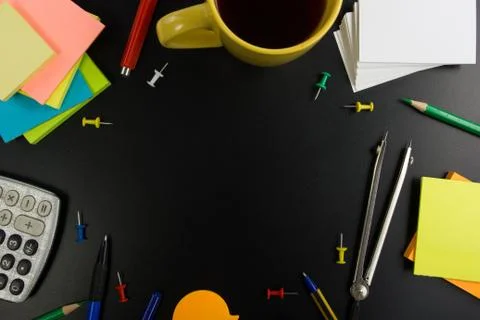 Office table desk top view with set of colorful supplies, white blank note pad Stock Photos