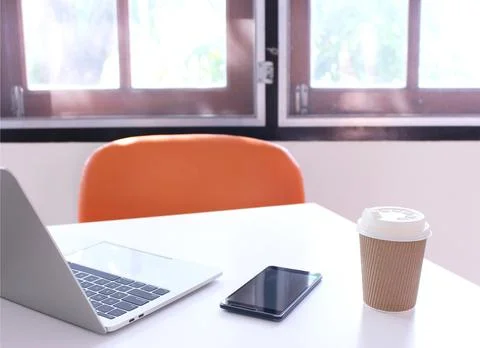 Office table desk. workspace with notebook and smartphone,cup coffee on cop.. Stock Photos
