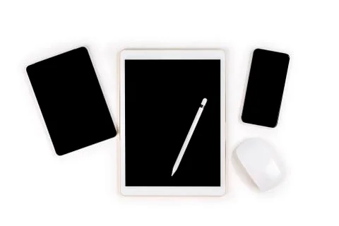 Office table with digital tablet, smartphone, mouse and pencil on isolated pu Stock Photos