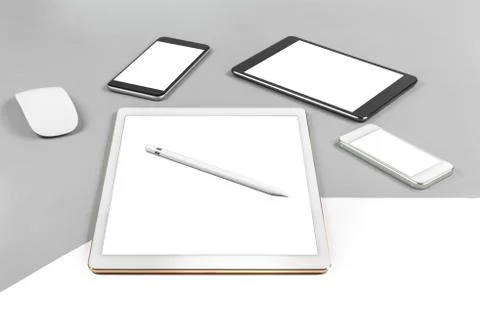 Office table with digital tablet, smartphone, mouse and pencil on isolated pu Stock Photos