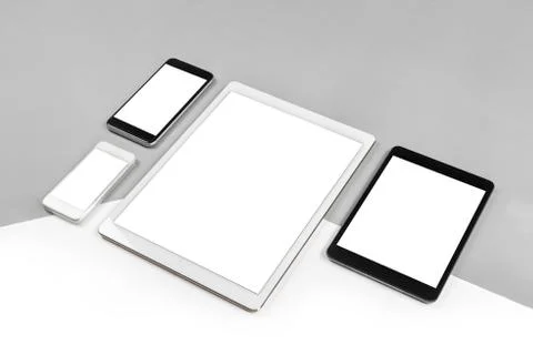 Office table with digital tablet, smartphone and mouse on isolated pure white Stock Photos