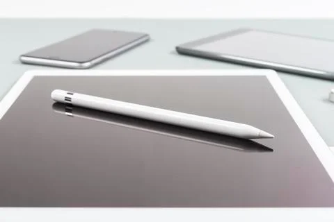 Office table with digital tablet, smartphone, mouse and pencil on isolated pu Stock Photos