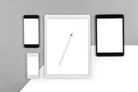 Office table with digital tablet, smartphone and pencil on isolated pure whit Stock Photos