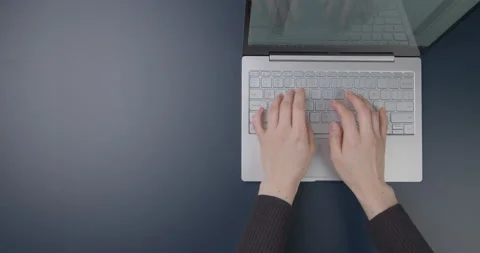 Office table. Hands of a girl working on a laptop. Flat lay Video stock 154690316