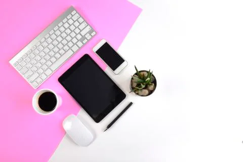 Office table with  keyboard, mouse, notebook, digital tablet and smartphone o Stock Photos