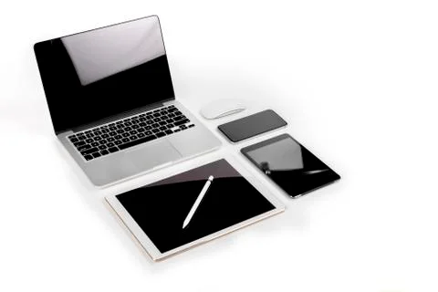 Office table with laptop computer, digital tablet, smartphone, p Stock Photos