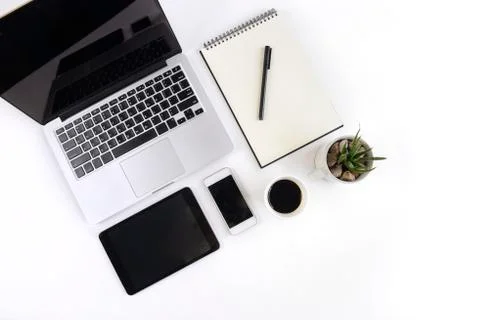 Office table with laptop computer, notebook, digital tablet and smartphone on Stock Photos