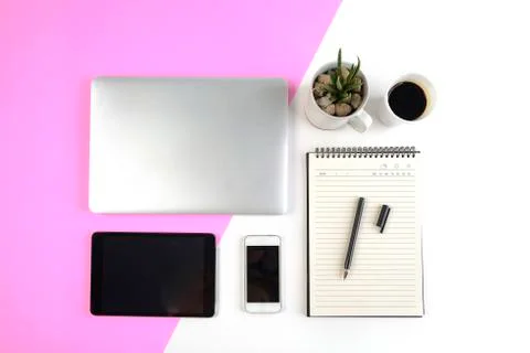 Office table with  laptop computer, notebook, digital tablet and smartphone o Stock Photos