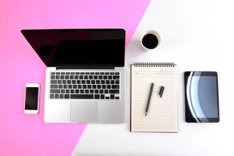 Office table with  laptop computer, notebook, digital tablet and smartphone o Stock Photos