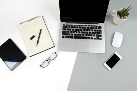 Office table with laptop computer, notebook, digital tablet and mobile phone  Stock Photos