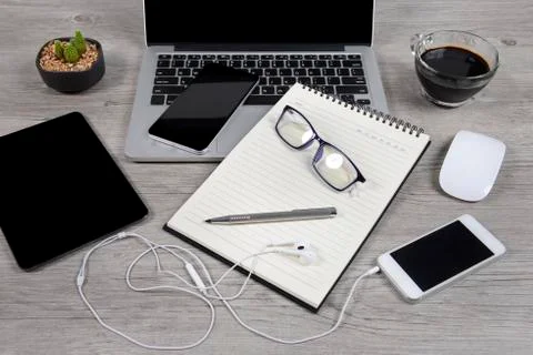 Office table with laptop computer, notebook, digital tablet, pen, smartphone, Stock Photos