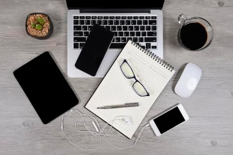 Office table with laptop computer, notebook, digital tablet, pen, smartphone, Stock Photos