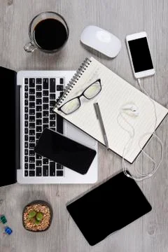 Office table with laptop computer, notebook, digital tablet, pen, smartphone, Stock Photos