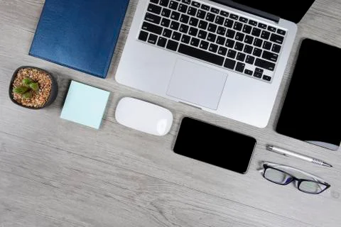 Office table with laptop computer, notebook, digital tablet, pen, smartphone, Stock Photos