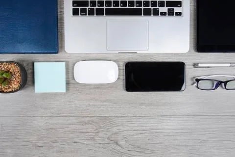 Office table with laptop computer, notebook, digital tablet, pen, smartphone, Stock Photos