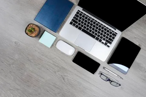 Office table with laptop computer, notebook, digital tablet, pen, smartphone, Stock Photos