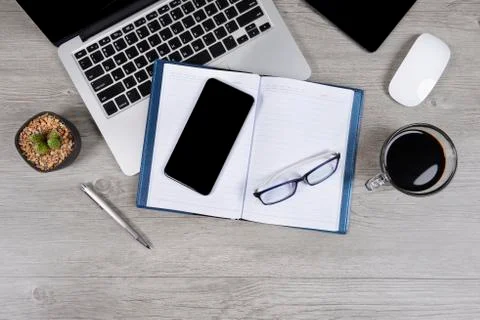 Office table with laptop computer, notebook, digital tablet, pen, smartphone, Stock Photos