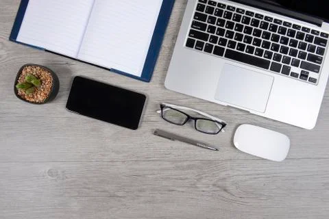 Office table with laptop computer, notebook, digital tablet, pen, smartphone, Stock Photos