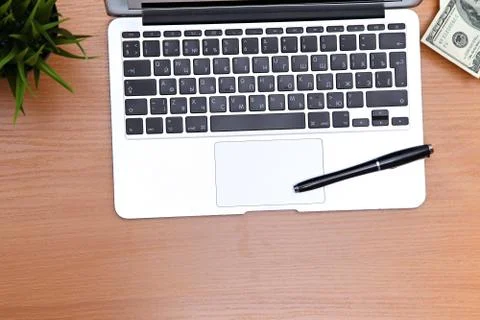 Office table with laptop, notepad and coffee cup. View from above with copy Stockfoto's