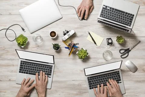 Office table with laptop Stock Photos