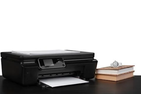 Office table with laser printer and books against white background Stock Photos