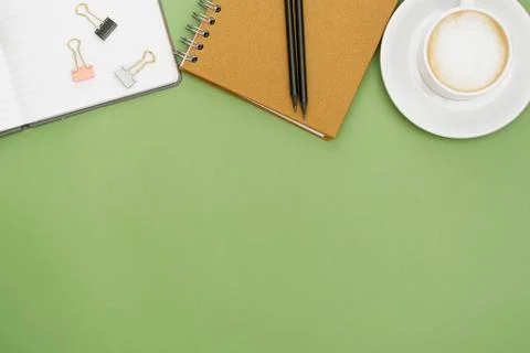 Office table with notebook and coffee cup. Top tabpe, work space with copy sp Foto stock