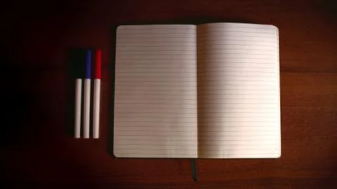 Office table with notebook and markers white page Stock Photos