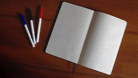 Office table with notebook and markers white paper Stock Photos