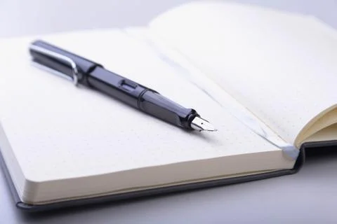 Office table with notebook and pen. copy space. Stock Photos