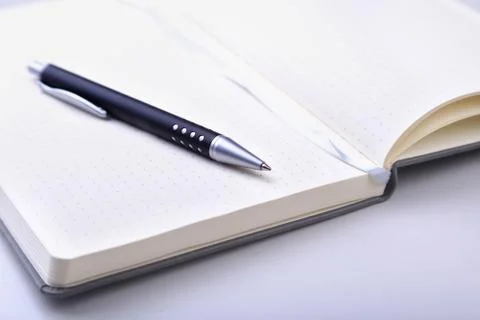 Office table with notebook and pen. copy space. Stock Photos