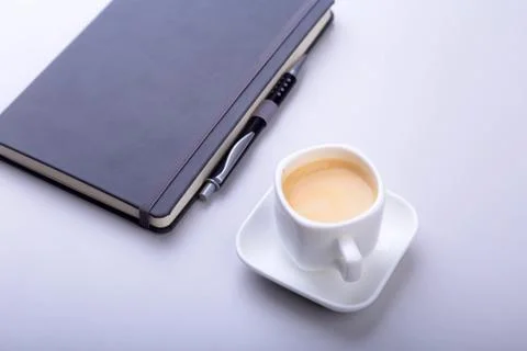 Office table with notebook, computer keyboard,, cup of coffee, tablet pc. copy Stock Photos