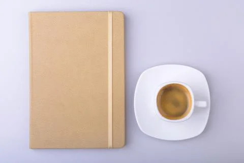 Office table with notebook, computer keyboard,, cup of coffee, tablet pc. copy Stock Photos