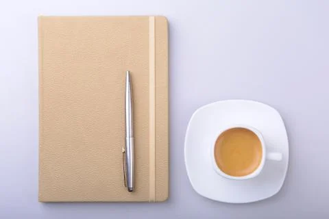 Office table with notebook, computer keyboard,, cup of coffee, tablet pc. copy Stock Photos