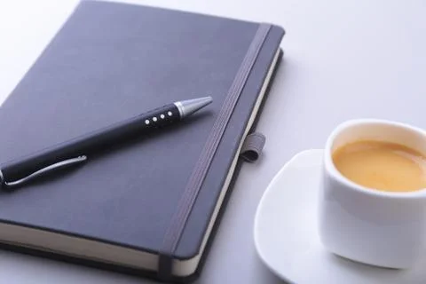 Office table with notebook, computer keyboard,, cup of coffee, tablet pc. copy Stock Photos