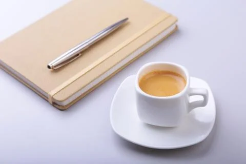 Office table with notebook, computer keyboard,, cup of coffee, tablet pc. copy Stock Photos