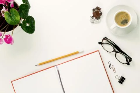 Office table with notepad and coffee cup. View from above with copy space Stock Photos