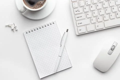 Office table with notepad, computer and coffee cup Stock Photos