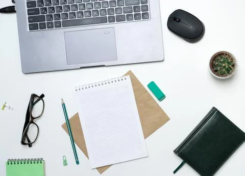 Office table with notepad, computer and notepad. View from above with copy space Stock Photos