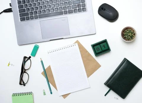 Office table with notepad, computer and notepad. View from above with copy space 库存照片
