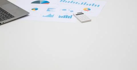Office table space working wiht notebook, calculator, business chart on white Stock Photos