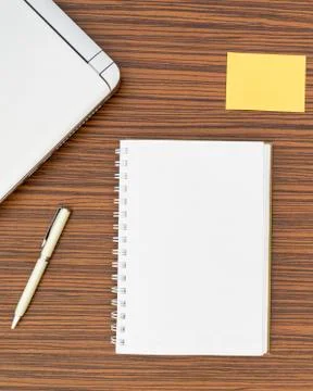 An office table working enviroment. Notepad, sticky note, pen plant, calculat Stock Photos