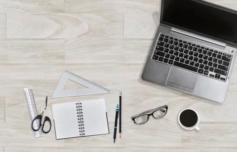 Office table workplace concept. Notebook, laptop, rulers, pencils, eyeglasses Фото